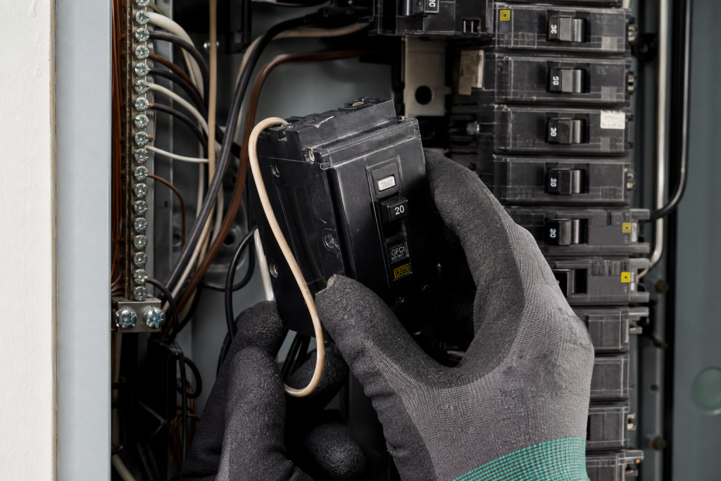 Close-up of GFCI breaker installation in panel